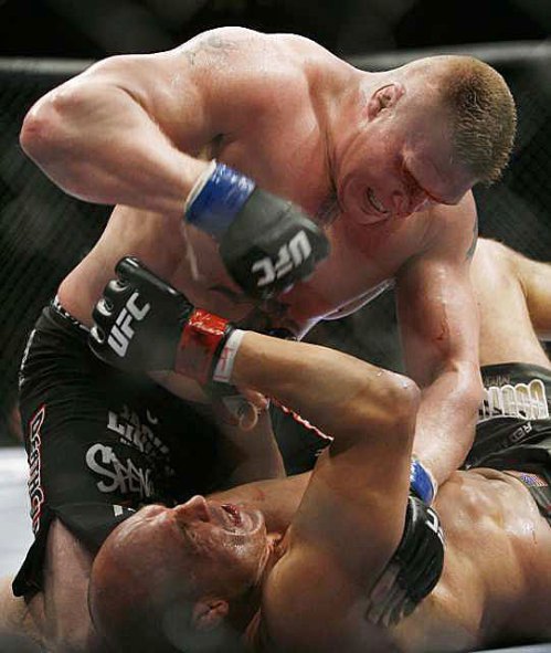 Lesnar pounds on a prone Couture after a blow behind left ear felled the aging champion.